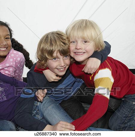 Stock Image - Children playing in tent. Fotosearch