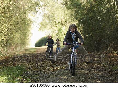 Children riding bikes in countryside View Large Photo Image Stock Image - Children riding bikes in countryside. Fotosearch