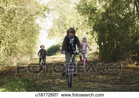 Children riding bikes in countryside View Large Photo Image Stock Photo - Children riding bikes in countryside. Fotosearch