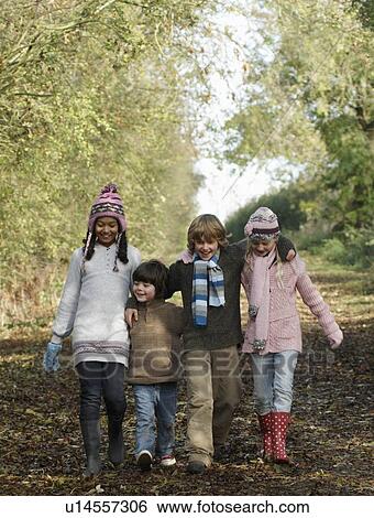 Stock Photograph - Children walking on country lane. Fotosearch