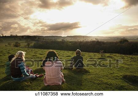 Children watching sunset on hill View Large Photo Image Stock Photo - Children watching sunset on hill. Fotosearch