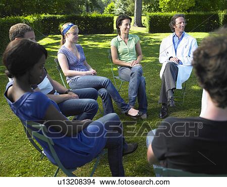 Circle of people sitting on chairs View Large Photo Image Picture - Circle of people sitting on chairs. Fotosearch