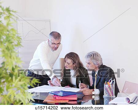 Co-workers in office View Large Photo Image Stock Image - Co-workers in office. Fotosearch