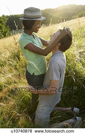 Stock Photo - Couple in a field. Fotosearch
