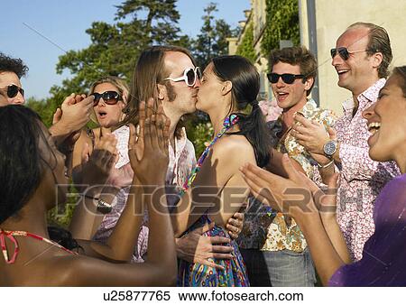 "Couple kissing, people clapping hands" View Large Photo Image Stock Photography - "Couple kissing, people clapping hands". Fotosearch