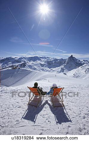 Couple reclining in deck chairs View Large Photo Image Picture - Couple reclining in deck chairs. Fotosearch