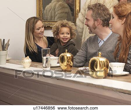 Stock Photograph - Customers having tea in café. Fotosearch