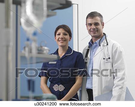 Stock Image - Doctor and nurse in hospital environment. Fotosearch