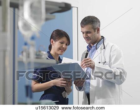Stock Photo - Doctor and nurse in hospital environment. Fotosearch