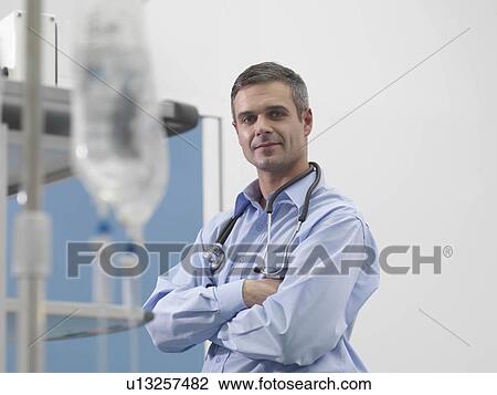 Stock Image - Doctor in hospital environment. Fotosearch