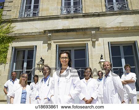 Doctors standing outdoors View Large Photo Image Stock Image - Doctors standing outdoors. Fotosearch