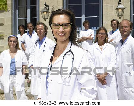 Doctors standing outdoors View Large Photo Image Stock Image - Doctors standing outdoors. Fotosearch