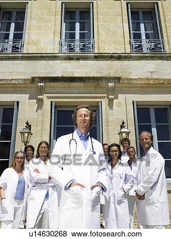 Stock Photo - Doctors standing outdoors. Fotosearch