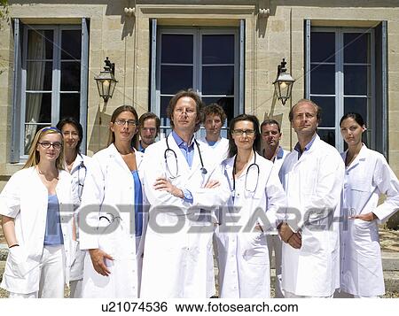 Doctors standing outdoors View Large Photo Image Stock Photograph - Doctors standing outdoors. Fotosearch