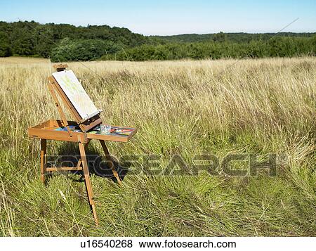 Easel in a field View Large Photo Image Stock Photo - Easel in a field. Fotosearch