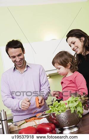 Family cooking together View Large Photo Image Stock Photo - Family cooking together. Fotosearch