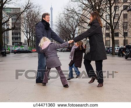 Family dancing near Eiffel Tower View Large Photo Image Stock Image - Family dancing near Eiffel Tower. Fotosearch