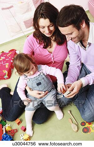 Stock Photograph - Family playing together. Fotosearch