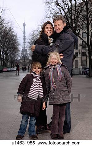 Stock Photography - Family portrait with Eiffel Tower. Fotosearch