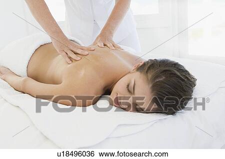 Stock Photograph - Female being given massage. Fotosearch