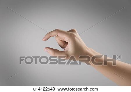 Female fingers indicating small size View Large Photo Image Stock Photo - Female fingers indicating small size. Fotosearch