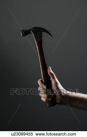 Female hand holding a hammer View Large Photo Image Stock Photography - Female hand holding a hammer. Fotosearch