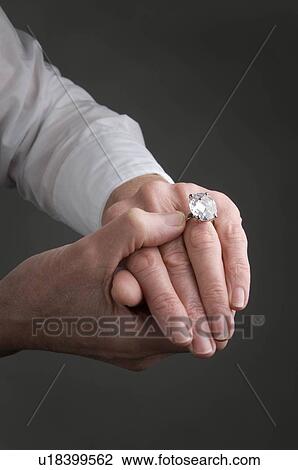 Stock Image - Female hand with diamond ring. Fotosearch