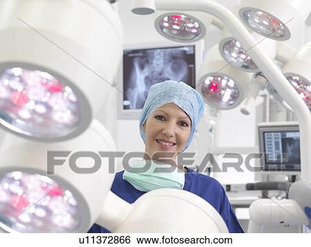 Stock Photograph - Female nurse in operating theatre. Fotosearch
