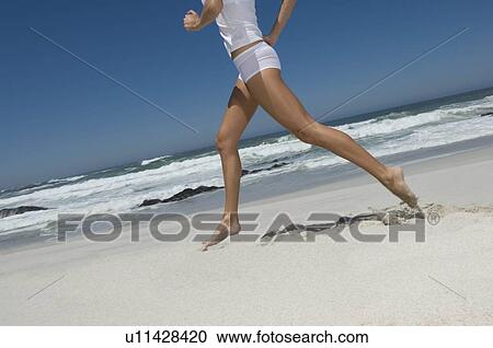 Female running on beach View Large Photo Image Stock Image - Female running on beach. Fotosearch