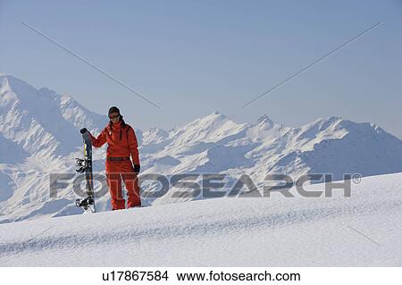Female snowboarder posing in the snow View Large Photo Image Picture - Female snowboarder posing in the snow. Fotosearch