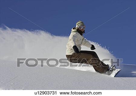 Female snowboarder turning off piste View Large Photo Image Stock Image - Female snowboarder turning off piste. Fotosearch