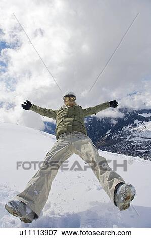 Female snowboarder walking with her snow View Large Photo Image Stock Photo - Female snowboarder walking with her snow. Fotosearch