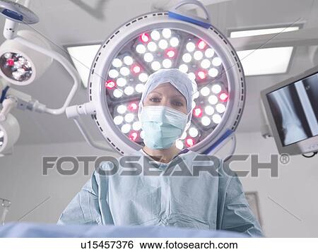 Stock Photograph - Female surgeon in operating theatre. Fotosearch
