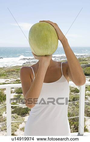 Female with fruit View Large Photo Image Picture - Female with fruit. Fotosearch