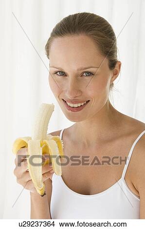 Picture - Female with fruit. Fotosearch