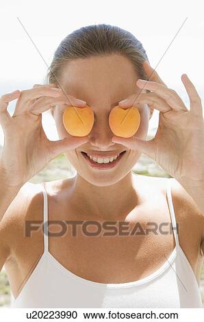 Stock Image - Female with fruit. Fotosearch