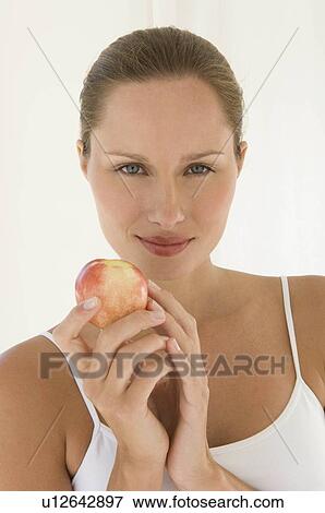 Stock Photo - Female with fruit. Fotosearch