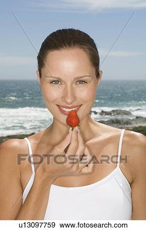 Female with fruit View Large Photo Image Stock Photo - Female with fruit. Fotosearch