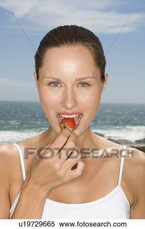 Stock Photography - Female with fruit. Fotosearch