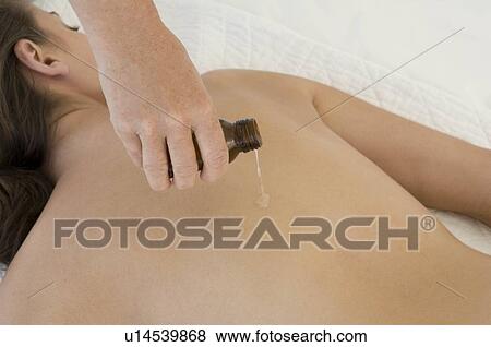 Female with massage oil View Large Photo Image Stock Photo - Female with massage oil. Fotosearch