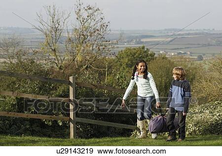 Girl and boy carrying tent bag View Large Photo Image Stock Photo - Girl and boy carrying tent bag. Fotosearch
