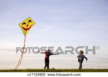 Girl And Boy Fly A Kite Stock Image U17124920 Fotosearch