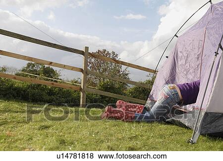 Girl climbing into tent View Large Photo Image Stock Photo - Girl climbing into tent. Fotosearch