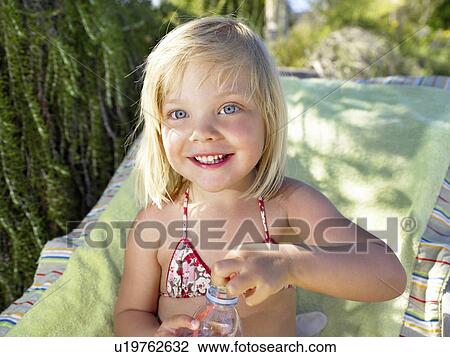 "Girl in swimsuit, smiling" View Large Photo Image Stock Image - "Girl in swimsuit, smiling". Fotosearch