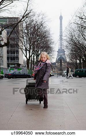 Girl running with shopping cart View Large Photo Image Stock Image - Girl running with shopping cart. Fotosearch