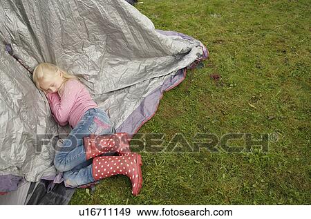 Girl sleeping on tent View Large Photo Image Stock Photo - Girl sleeping on tent. Fotosearch