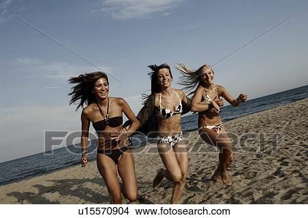 Girl teenagers running on the beach View Large Photo Image Picture - Girl teenagers running on the beach. Fotosearch