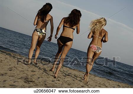 Girl teenagers running on the beach View Large Photo Image Stock Photo - Girl teenagers running on the beach. Fotosearch