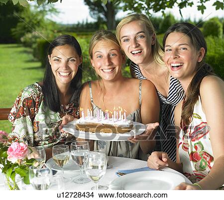 Girlfriends celebrating a birthday View Large Photo Image Picture - Girlfriends celebrating a birthday. Fotosearch