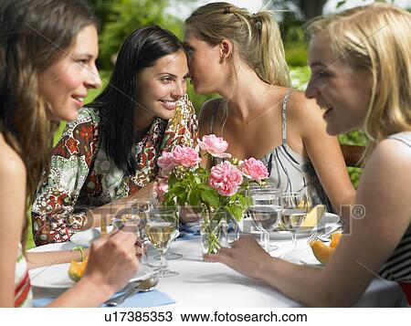 Girlfriends having lunch outdoors View Large Photo Image Stock Image - Girlfriends having lunch outdoors. Fotosearch